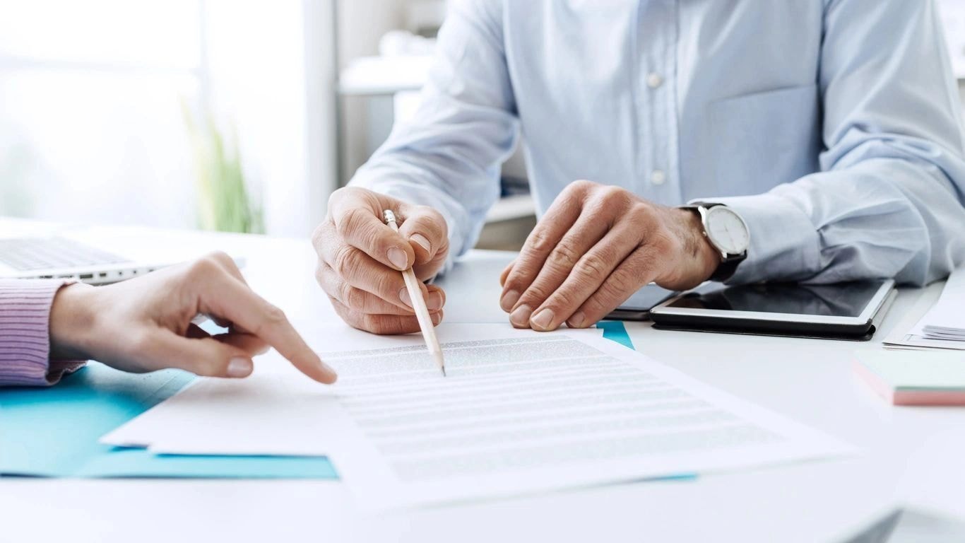 Professionals collaborating at a desk